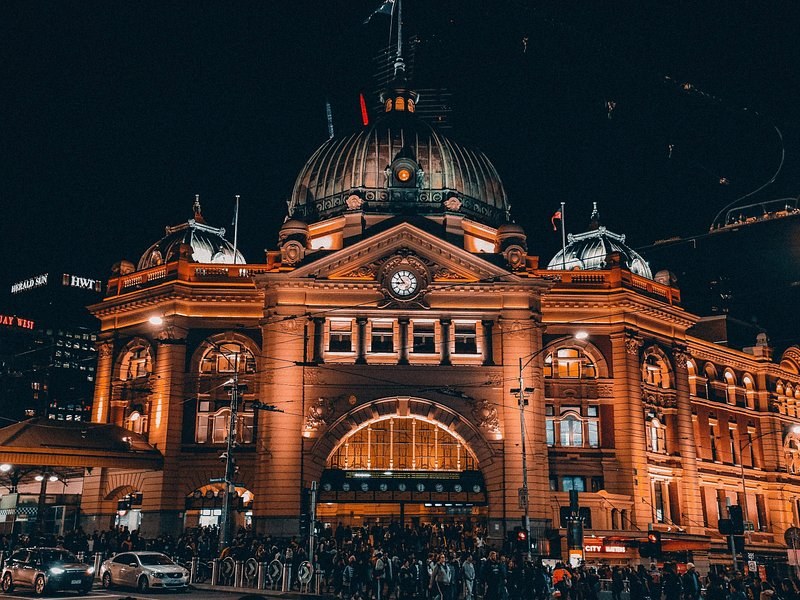 Flinders Street Station lit up at night in central Melbourne